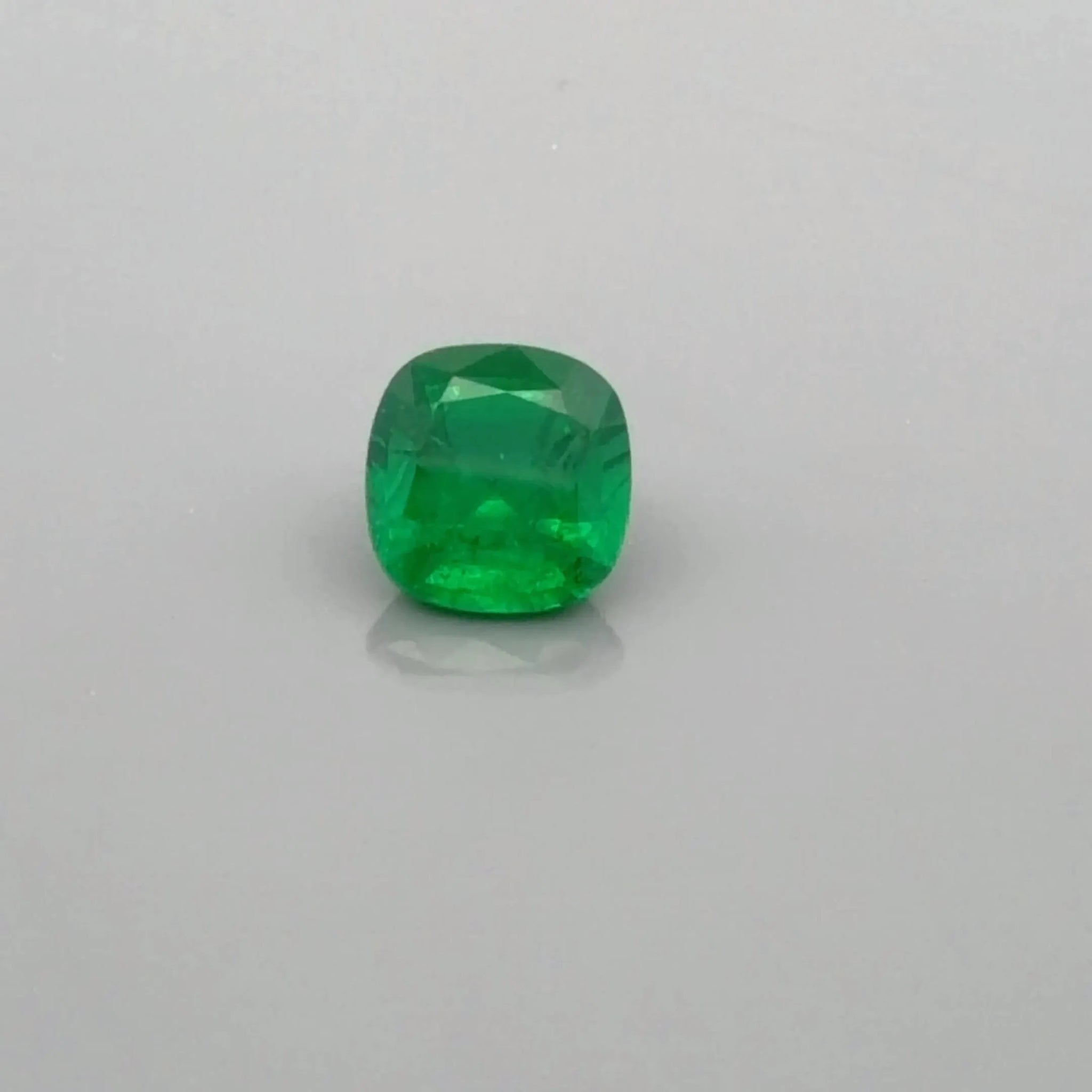 0.92ct Cushion Natural Emerald (Colour Green, Clarity Slightly Included, Cut Faceted)